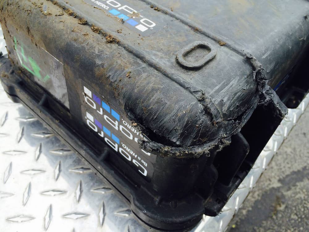  Pelican 1400 Series case damaged from falling from a vehicle traveling 75mph, getting run over, falling 50 feet onto another road. 